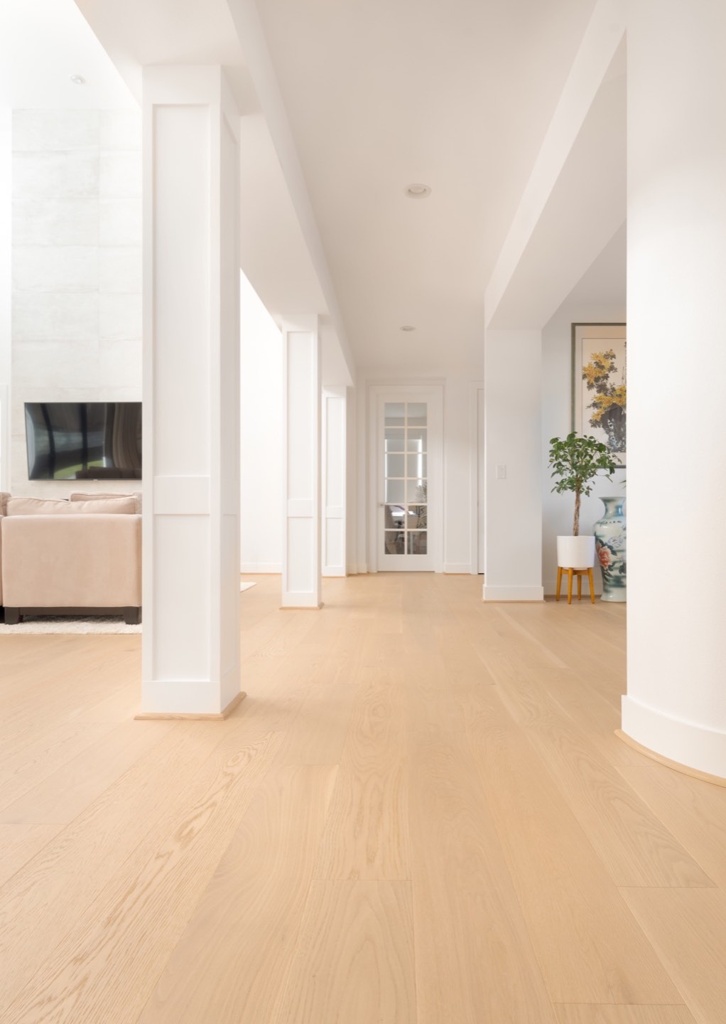Continuous flooring through a completed LeviArs kitchen and living space