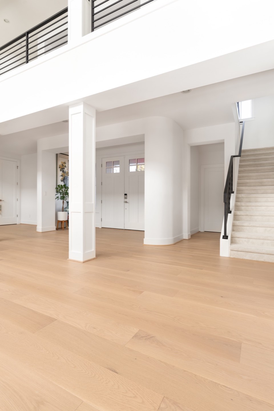 Light wide-plank flooring through a completed LeviArs whole-home remodel