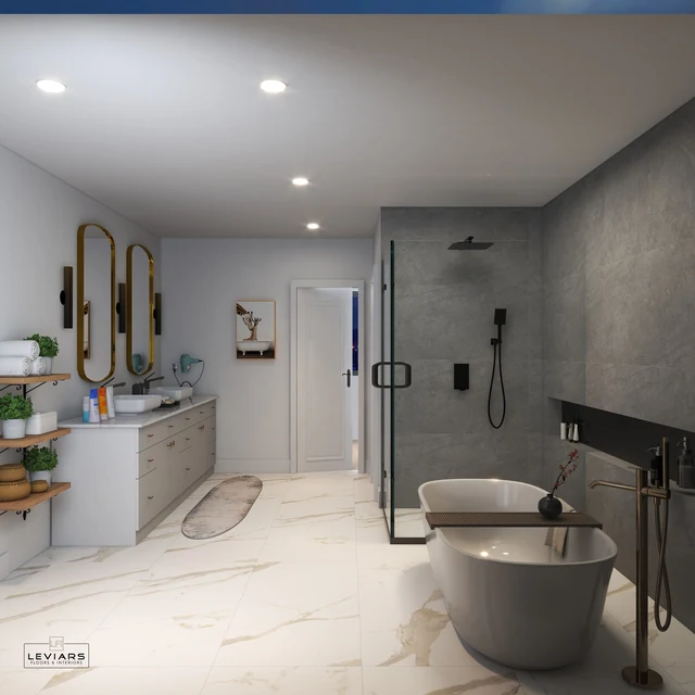 Freestanding tub facing a gray walk-in shower and white double vanity