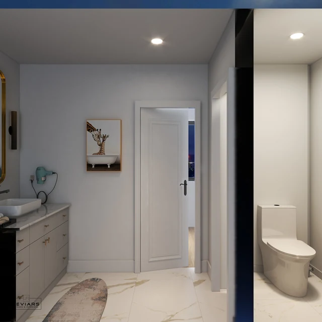 Bathroom doorway and separate toilet area beside the vanity