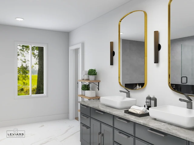 Dark vanity countertop with vessel sinks and gold-framed mirrors