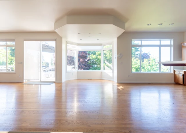 Original dining space with wood flooring and garden-facing windows