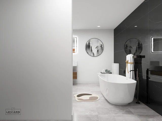 Bathroom partition beside a freestanding tub and dark tiled shower wall