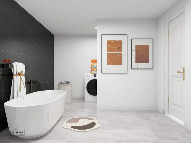 Pale bathroom floor beside a white bathtub and concealed laundry area