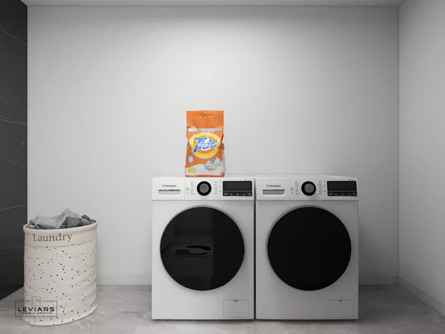 Side-by-side washer and dryer in a recessed bathroom laundry nook
