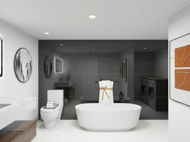 White freestanding bathtub in front of a dark tiled walk-in shower