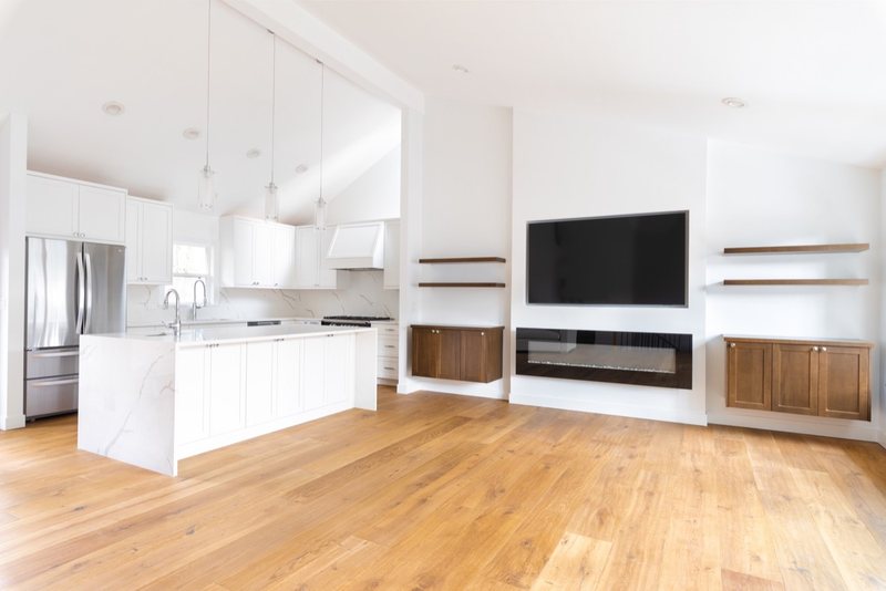 Modern living room fireplace remodel with coordinated interior finishes, view 3 of 8