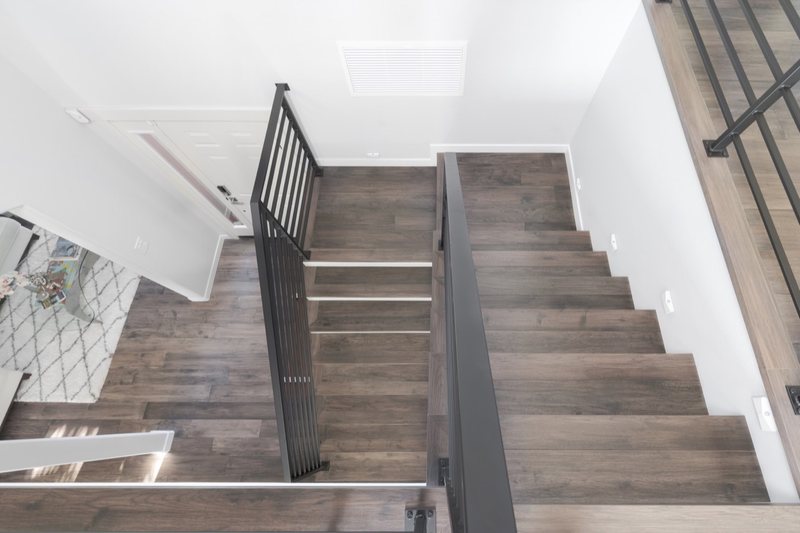 Flooring and staircase remodeling with coordinated treads, landings and transitions, view 4 of 16