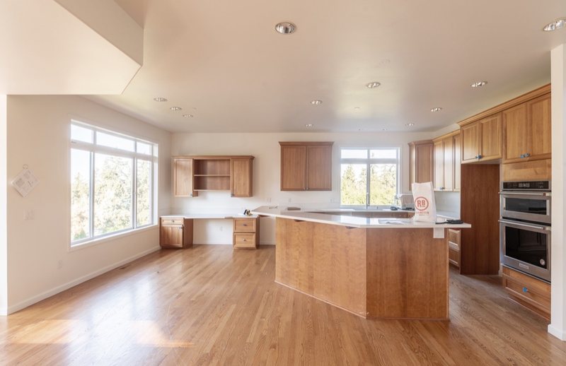 Coordinated kitchen, fireplace and staircase remodeling detail, view 2 of 25