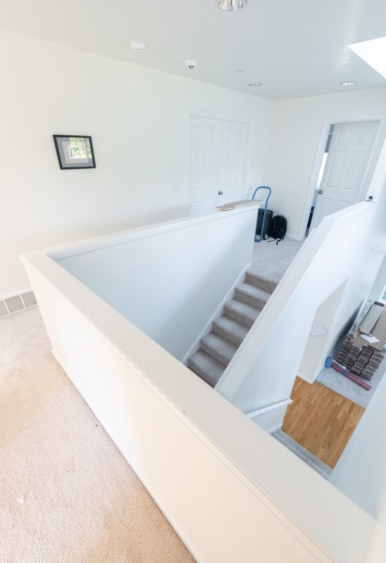 Coordinated kitchen, fireplace and staircase remodeling detail, view 7 of 25