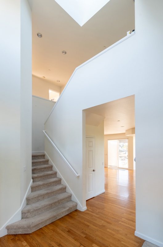 Coordinated kitchen, fireplace and staircase remodeling detail, view 9 of 25
