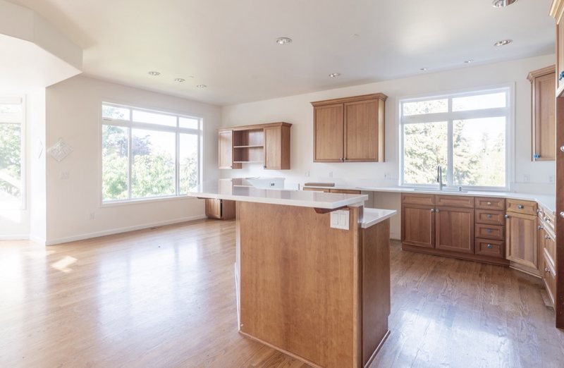 Coordinated kitchen, fireplace and staircase remodeling detail, view 16 of 25
