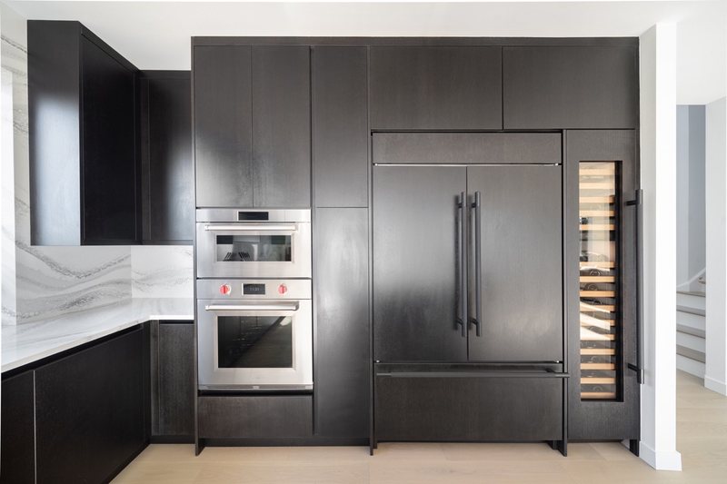 Coordinated kitchen, fireplace and staircase remodeling detail, view 20 of 25