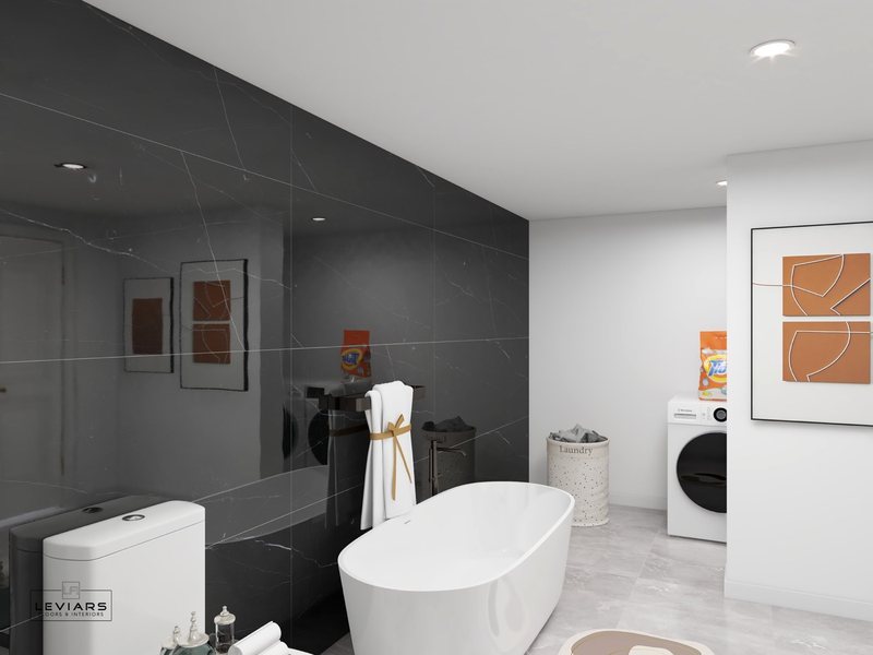 Modern primary bathroom with dramatic stone surfaces and freestanding tub, view 7 of 14