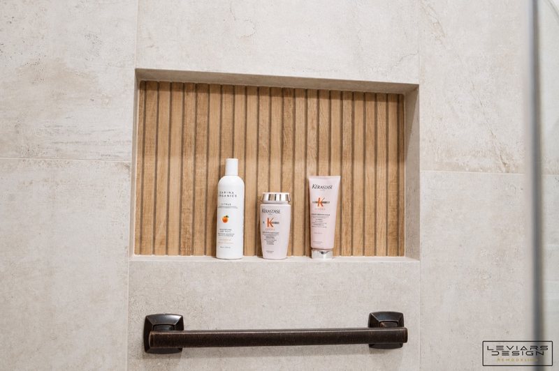 Warm modern bathroom with wood-look tile and black fixtures, view 8 of 8