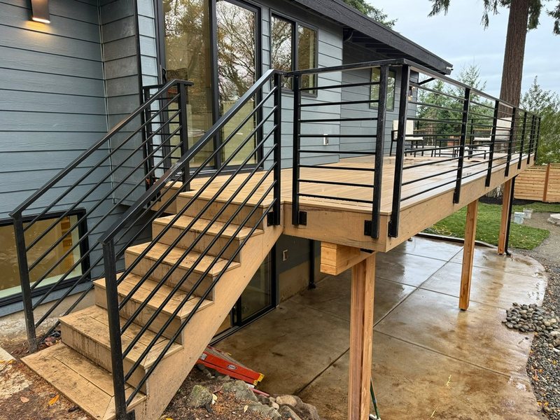 Custom black metal deck and stair railing installation