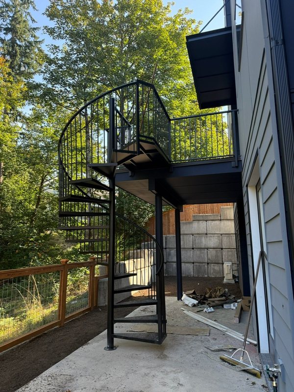 Custom black metal stair railing and handrail installation detail, view 3 of 18