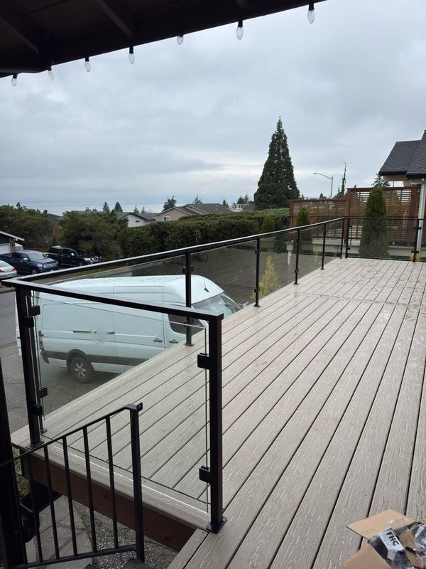 Custom black metal stair railing and handrail installation detail, view 15 of 18