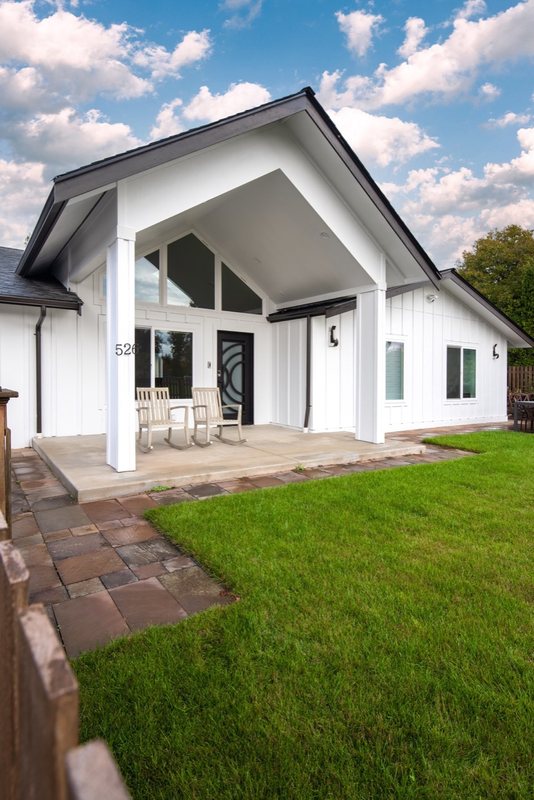 Exterior view of the remodeled home and lawn