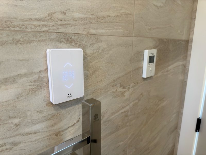 Bathroom wall controls and tile finish