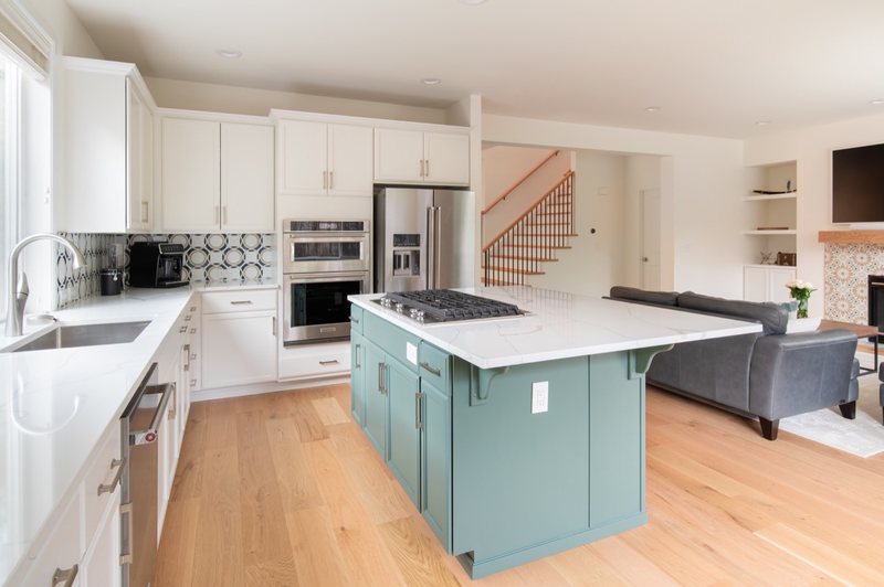 Connected whole-home interior with dining room, stairs, fireplace and flooring, view 4 of 12