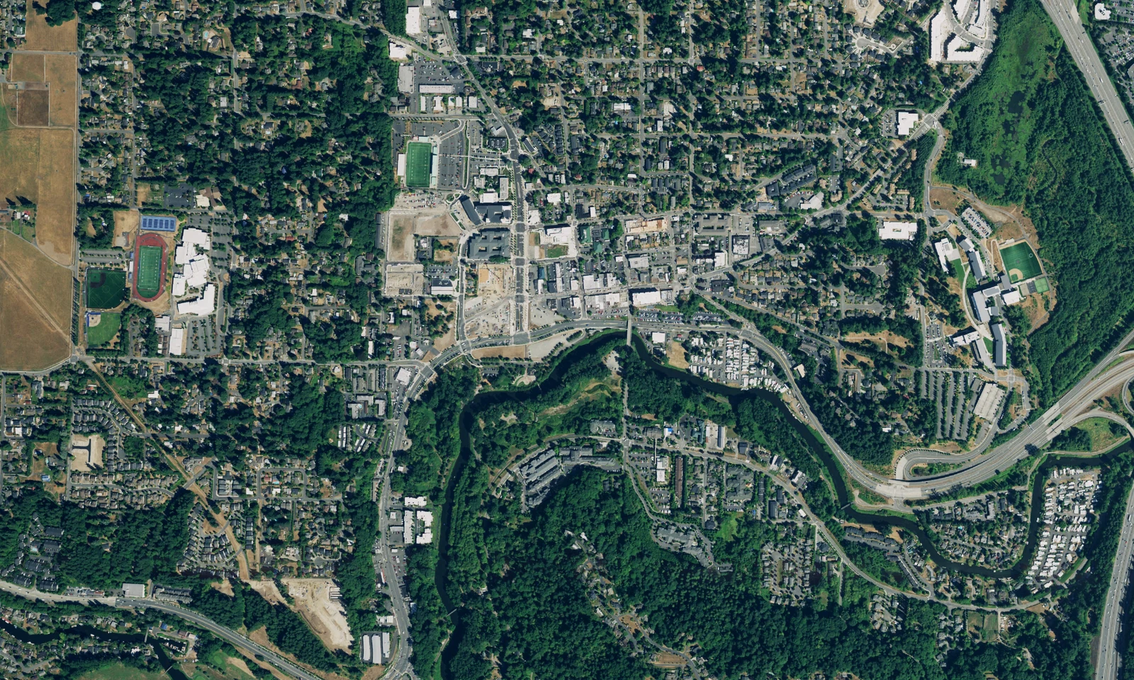 Aerial view of downtown Bothell, Washington, and the green Sammamish River corridor. LeviArs Design & Remodeling service area.