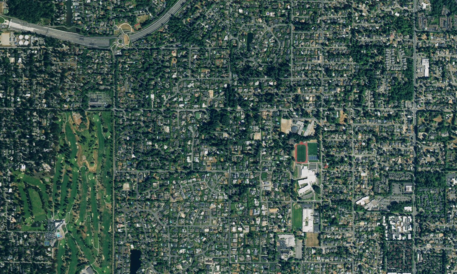 Aerial view of Clyde Hill, Washington, with landscaped residential blocks and broad areas of green space. LeviArs Design & Remodeling service area.
