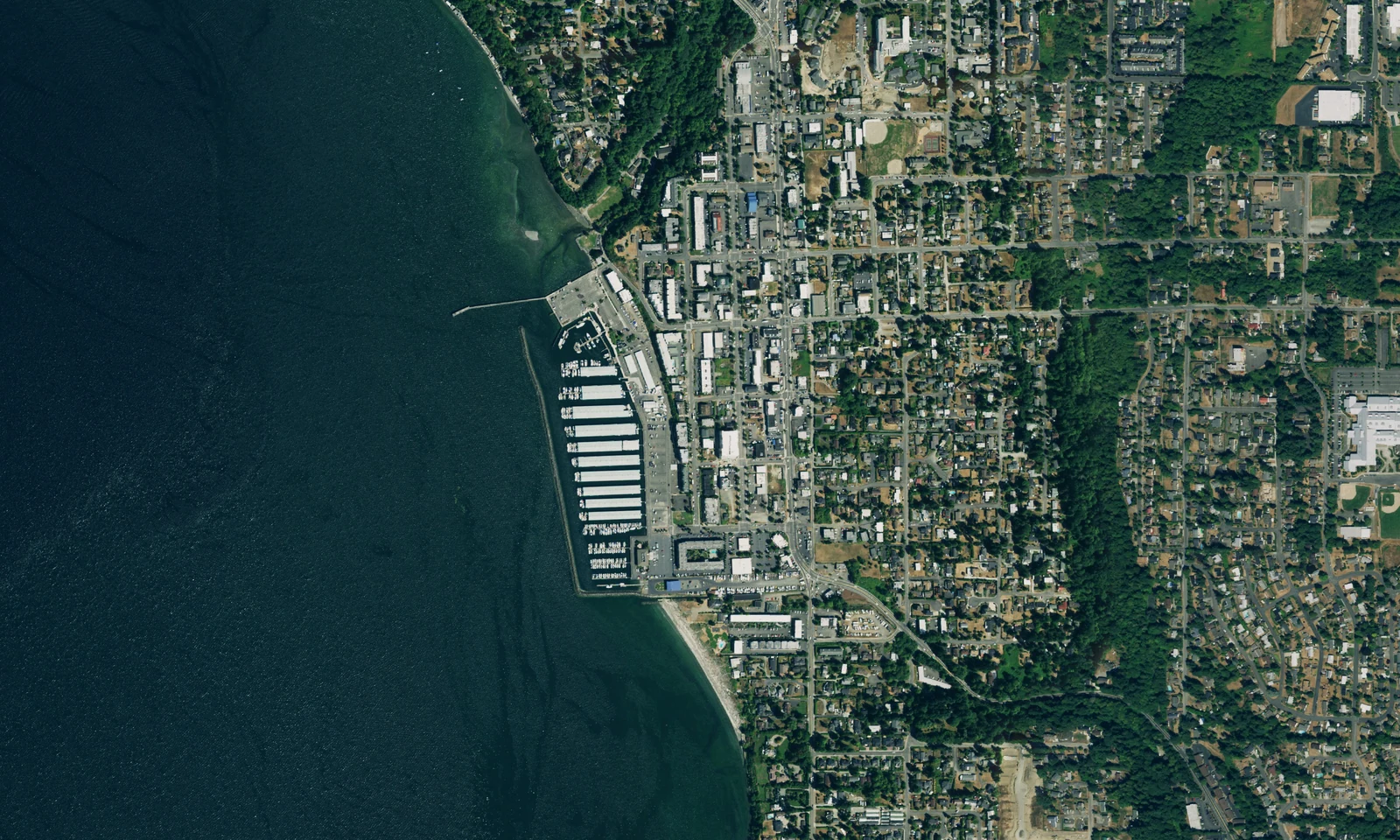 Des Moines, Washington, marina and Puget Sound waterfront, with neighborhoods extending inland. LeviArs Design & Remodeling service area.