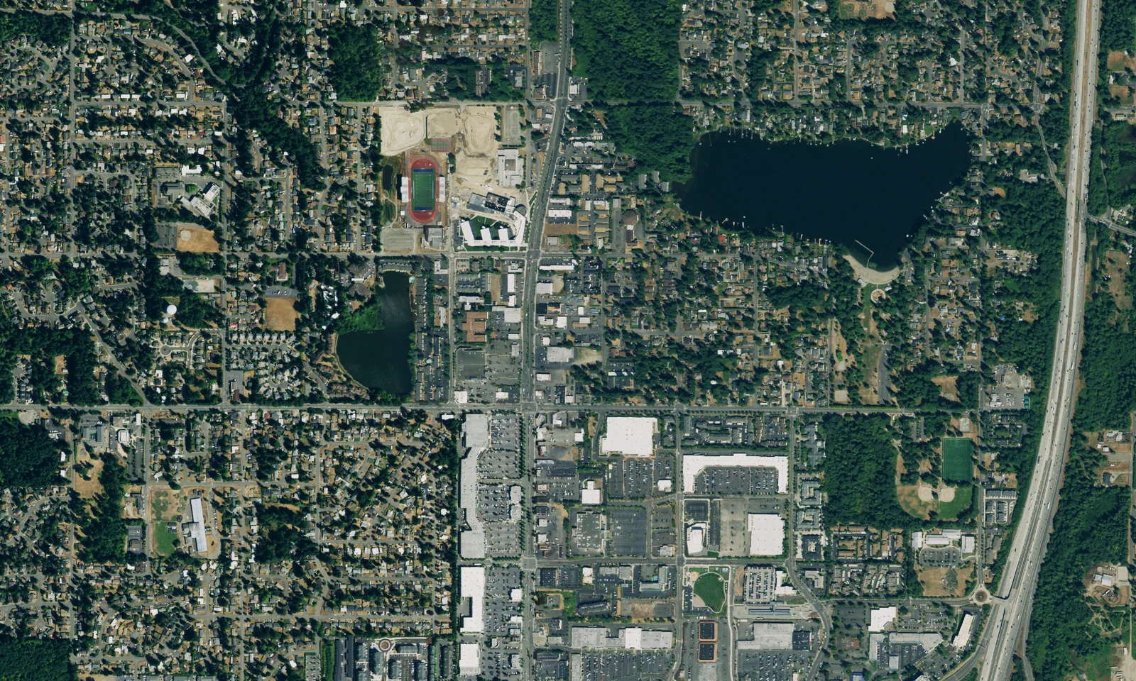 Federal Way, Washington, from above, showing lakes, wooded neighborhoods and the central commercial corridor. LeviArs Design & Remodeling service area.