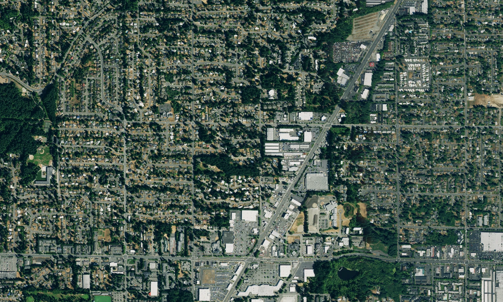 Lynnwood, Washington, photographed from above, showing leafy neighborhoods and its main commercial streets. LeviArs Design & Remodeling service area.