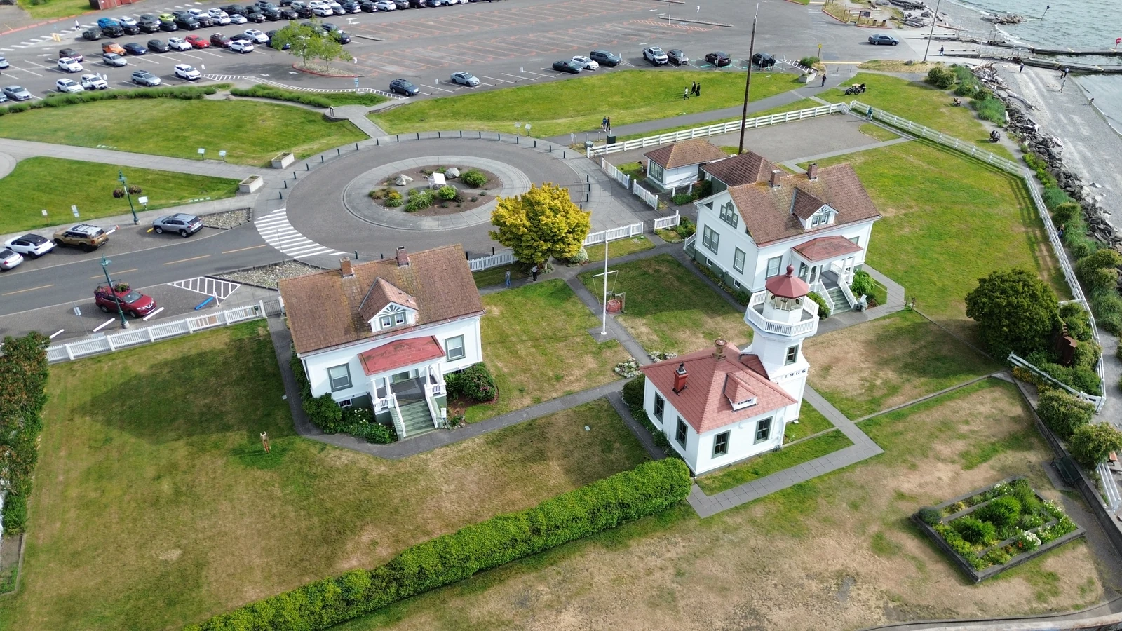 Mukilteo Lighthouse Park, with its white lighthouse, red roofs, green lawns and Puget Sound shoreline. LeviArs Design & Remodeling service area.