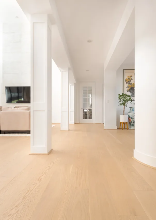 Light wood flooring continuing through an interior hallway in Woodinville, Washington
